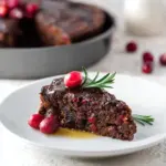 Christmas Cranberry Pudding served with rich butter sauce