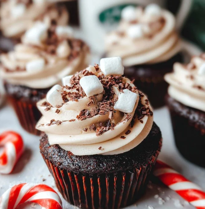 Delicious hot chocolate cupcakes topped with creamy frosting and chocolate sprinkles