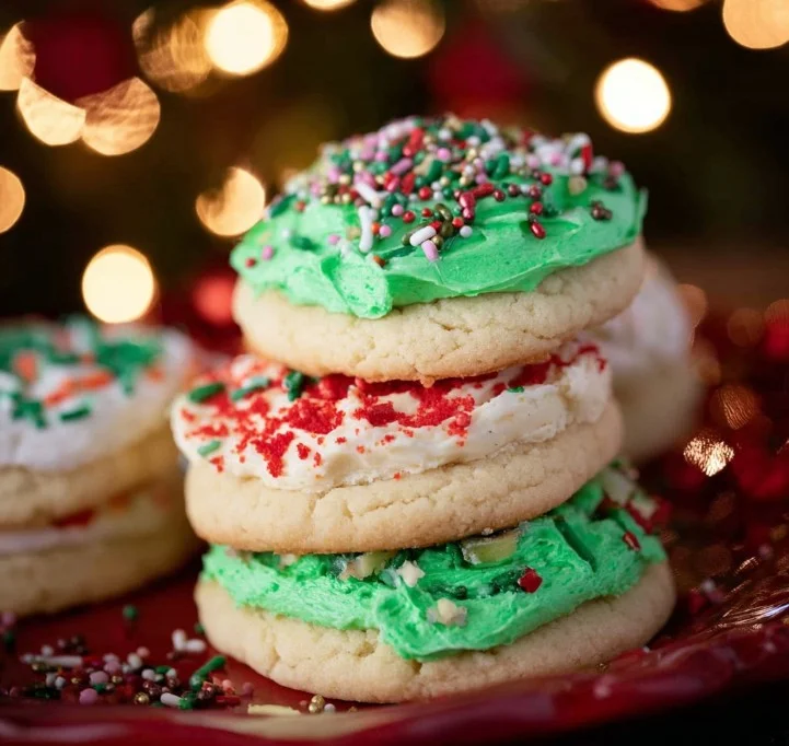 Colorful Lofthouse Cookies with frosting and sprinkles on a white background