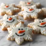 Festively decorated Christmas sugar cookies on a platter