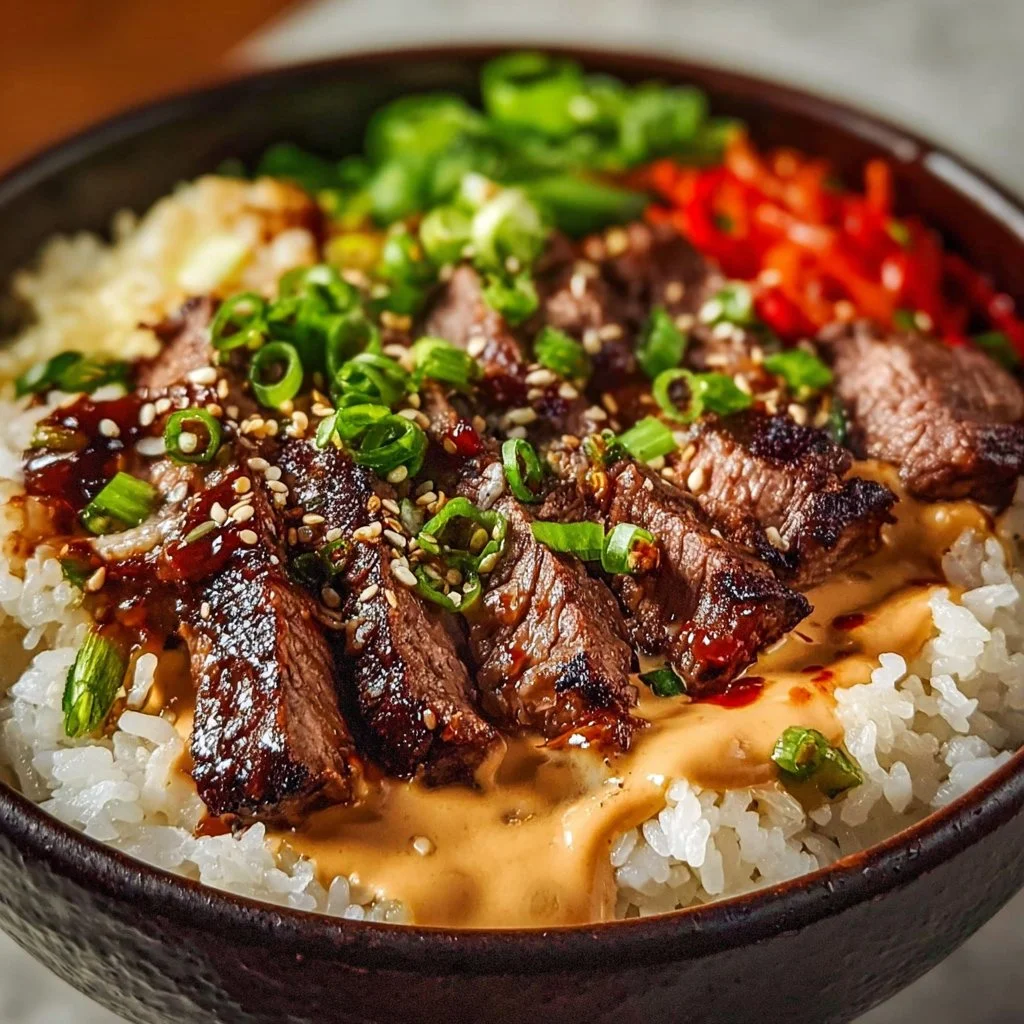 Korean BBQ steak rice bowl topped with spicy cream sauce