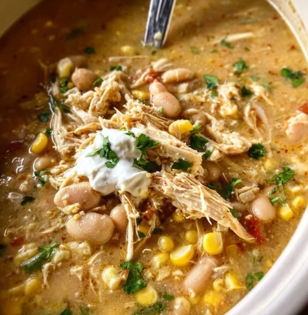 Delicious bowl of Crockpot White Chicken Chili garnished with cilantro and lime.