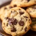 Batch of easy sourdough chocolate chip cookies on a cooling rack