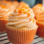 Delicious orange cupcakes with creamy frosting and orange zest decoration