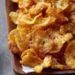 Crispy air fryer pasta chips ready to be served with dipping sauce