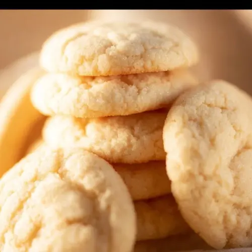 Plate of freshly baked Amish Sugar Cookies with decorative icing.