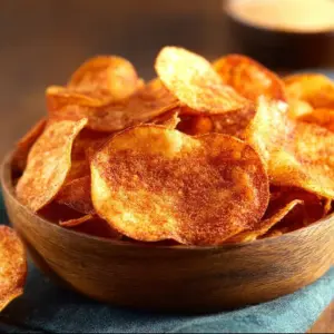 Bowl of crispy homemade BBQ chips ready to be enjoyed as a snack