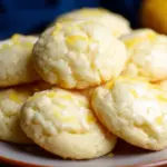 Freshly baked lemon ricotta cookies on a cooling rack
