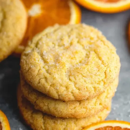 Freshly baked orange cookies with a zesty flavor and appealing texture