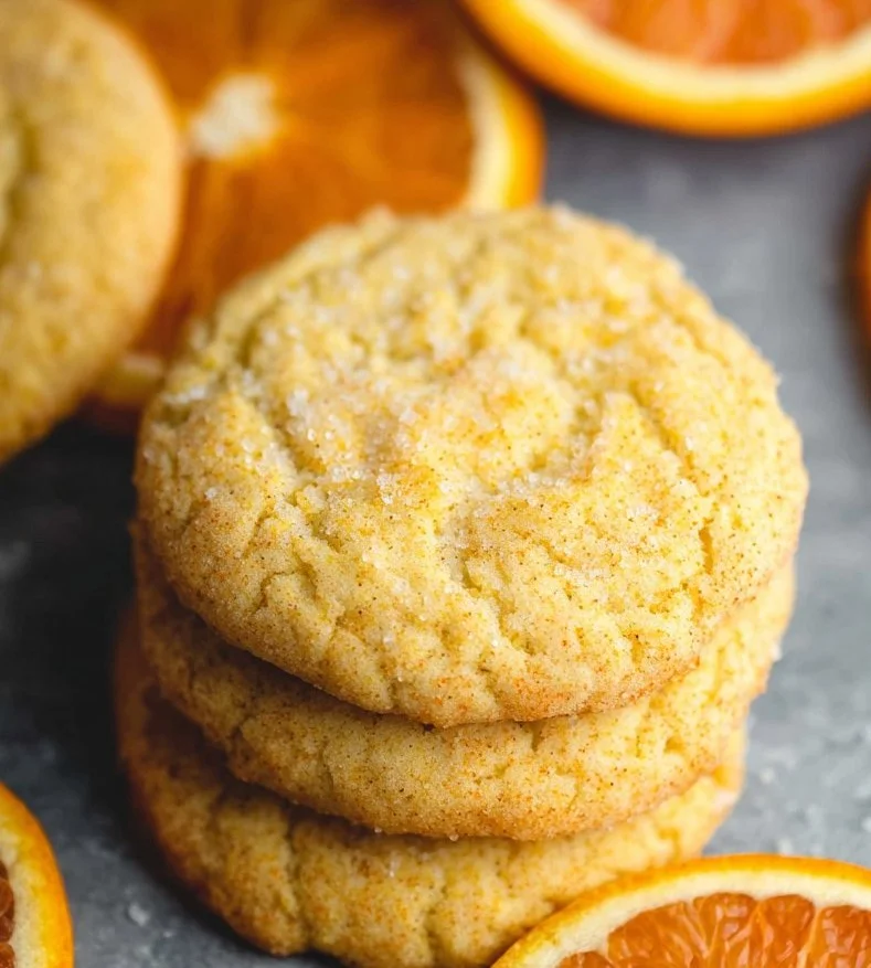 Freshly baked orange cookies with a zesty flavor and appealing texture