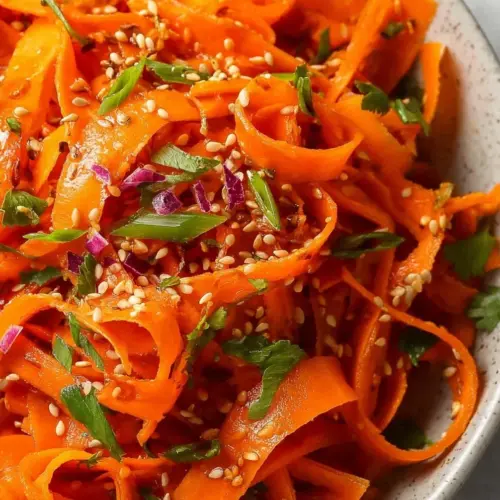 Easy carrot salad with Asian dressing featuring vibrant colors and fresh ingredients