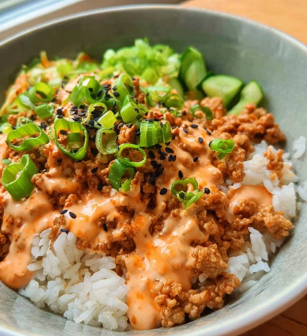 Ground turkey rice bowls with Bang Bang sauce ready to serve.
