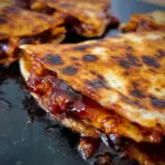 Delicious Blackstone Hot Honey BBQ Chicken Quesadillas served on a platter