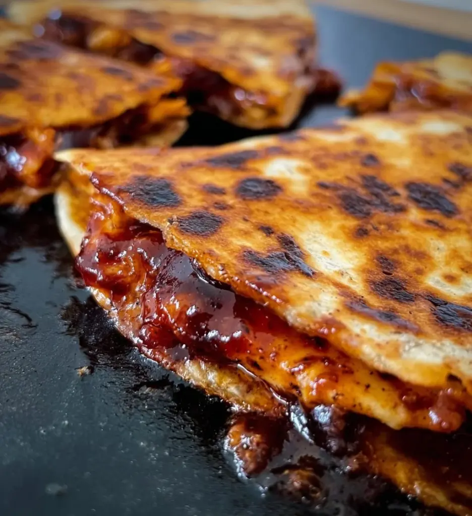 Delicious Blackstone Hot Honey BBQ Chicken Quesadillas served on a platter