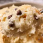 A bowl of creamy cottage cheese cookie dough ready for baking or raw consumption.