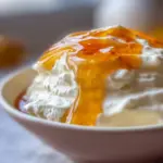 Bowl of homemade Instant Pot Greek yogurt topped with fresh fruit and honey