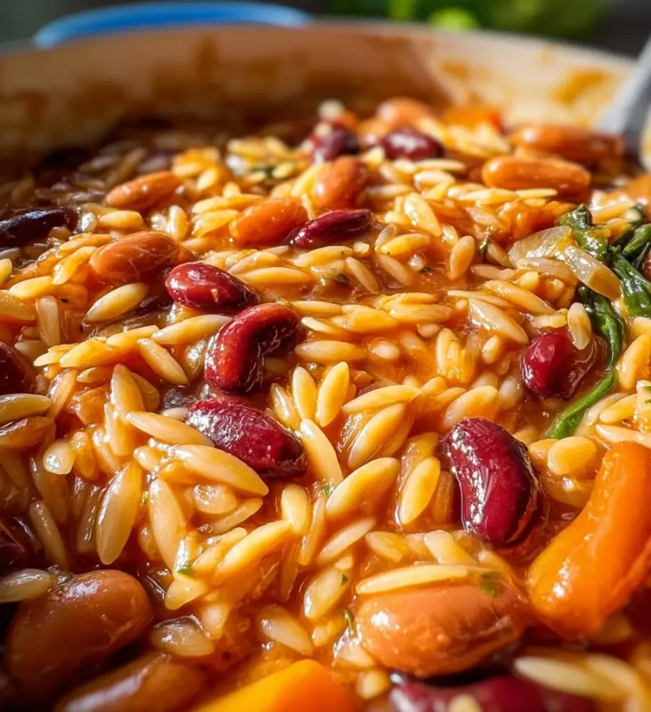 Mediterranean Orzo and Beans dish served in a bowl with herbs and vegetables