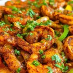 Colorful sheet pan shrimp fajitas with peppers and onions ready to eat