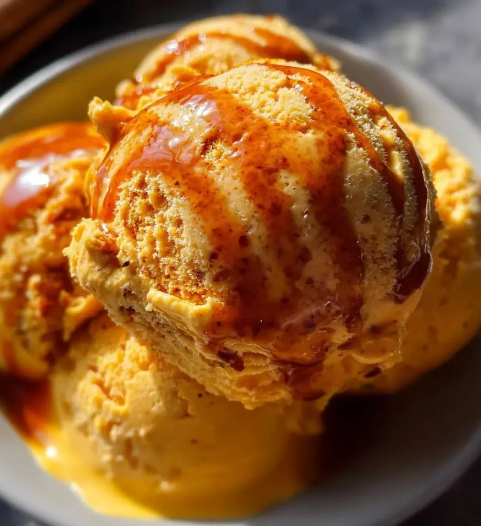 Delicious Carrot Cake Ice Cream topped with cream and nuts