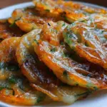 Crispy rice paper scallion pancakes served on a plate.