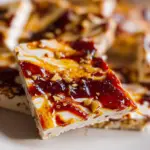 Frozen Cottage Cheese Bark with fruits and nuts on a plate