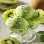 Bowl of fresh kiwi sorbet served with slices of kiwi on top