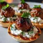 Mini Greek meatball bites with tzatziki sauce on pita bread