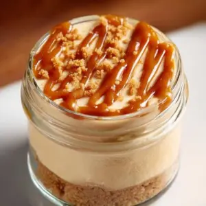 Peanut butter cottage cheese cheesecake cups served in stylish dessert cups.