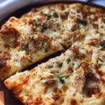 Roasted garlic white chicken pizza with fresh ingredients and cheese