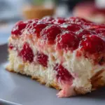 Delicious White Chocolate Raspberry Tiramisu dessert served on a white plate